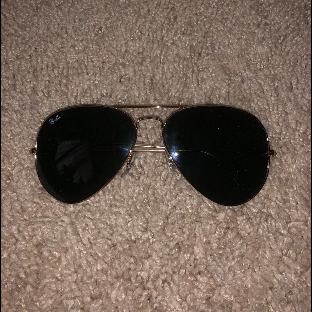 Black and gold ray bans
